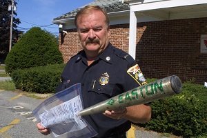 A cop with a baseball bat - HeadStuff.org