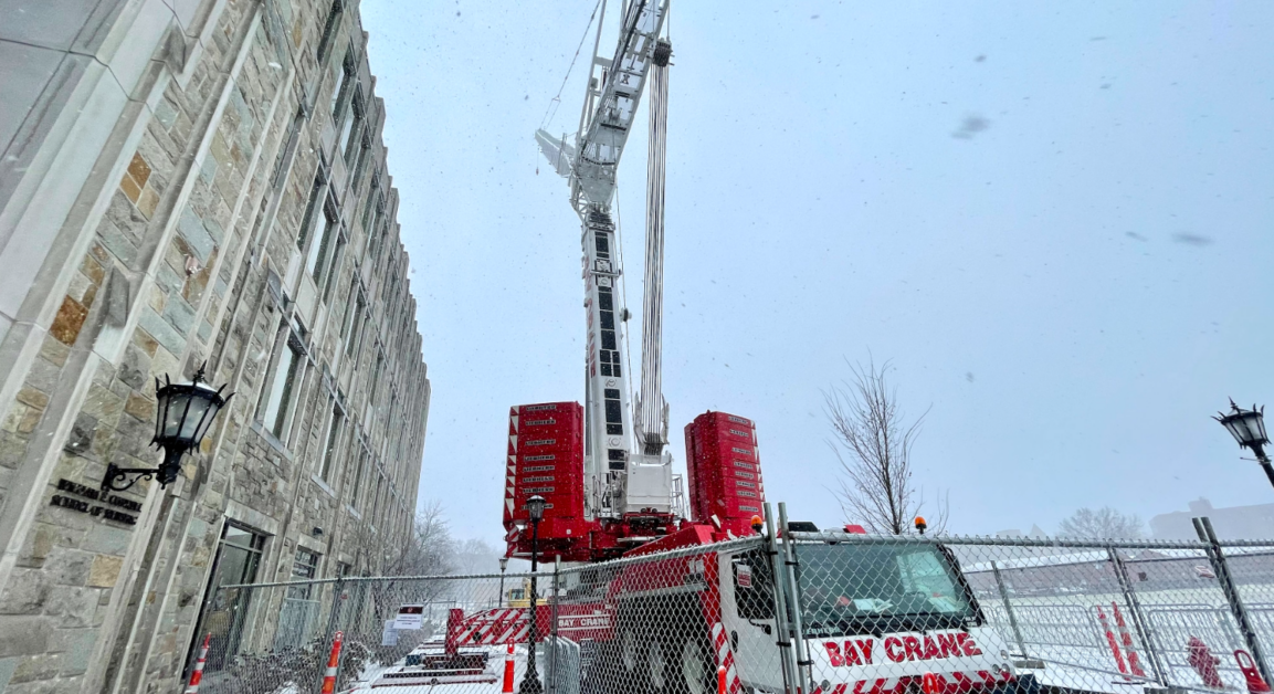University Temporarily Places Crane in Front of Maloney To Address Rock Shifting The Heights