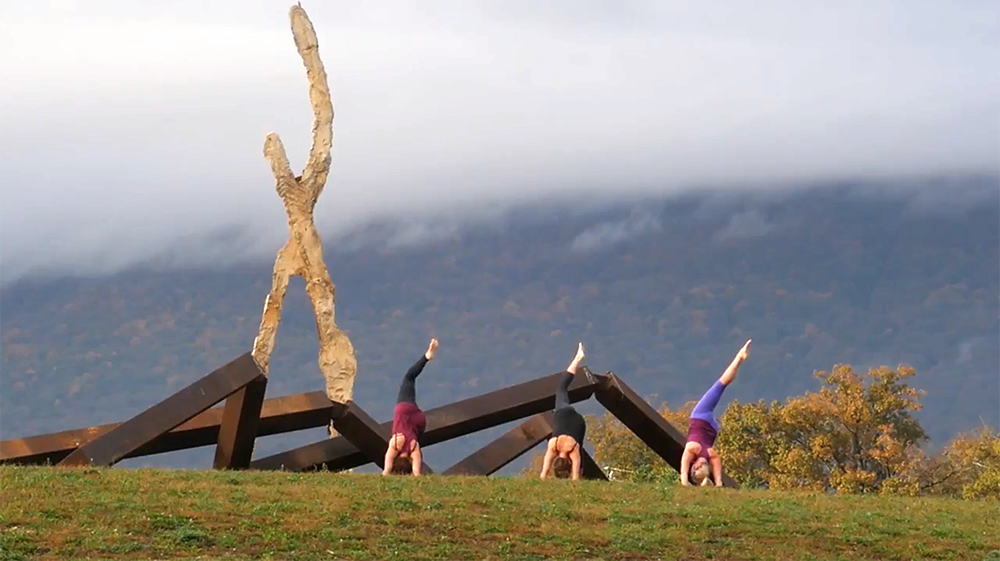 People performing yoga Sculpture Fields in Chattanooga, TN