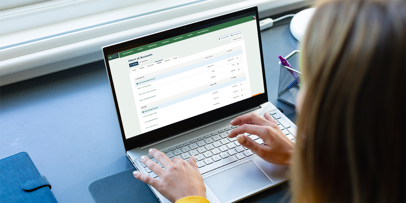 A bookkeeper reviewing their chart of accounts in MonkeyPod