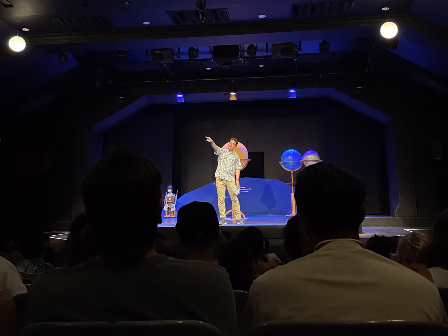 Honolulu Theatre for Youth Executive Director Eric Johnson speaking from the stage.