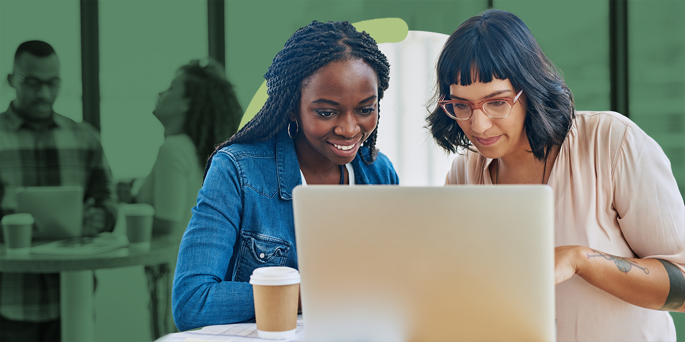 Two nonprofit professionals collaborating on a grant application