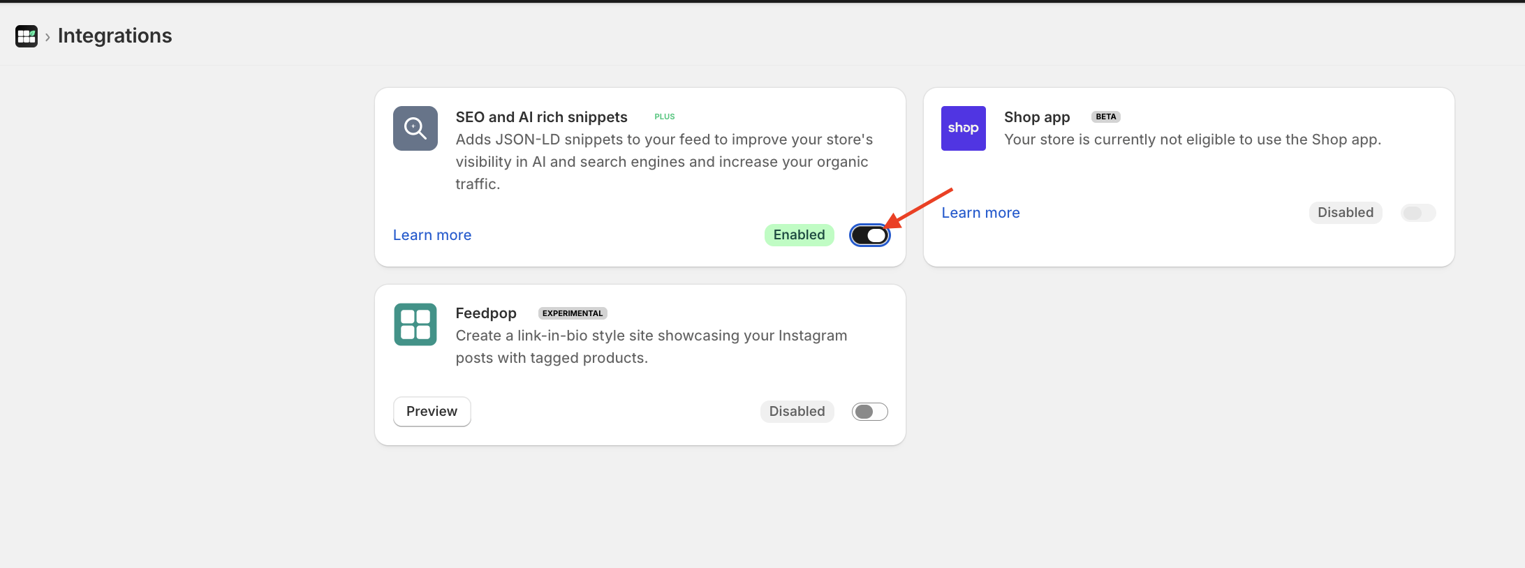 Screenshot of Instafeed app integrations page, with a red arrow pointing to the Enabled toggle.