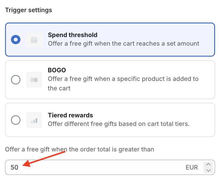 Red arrow pointing to the Spend threshold value of the Mintt - Free Gift app.