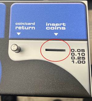 A coin slot with a red circleAI-generated content may be incorrect.