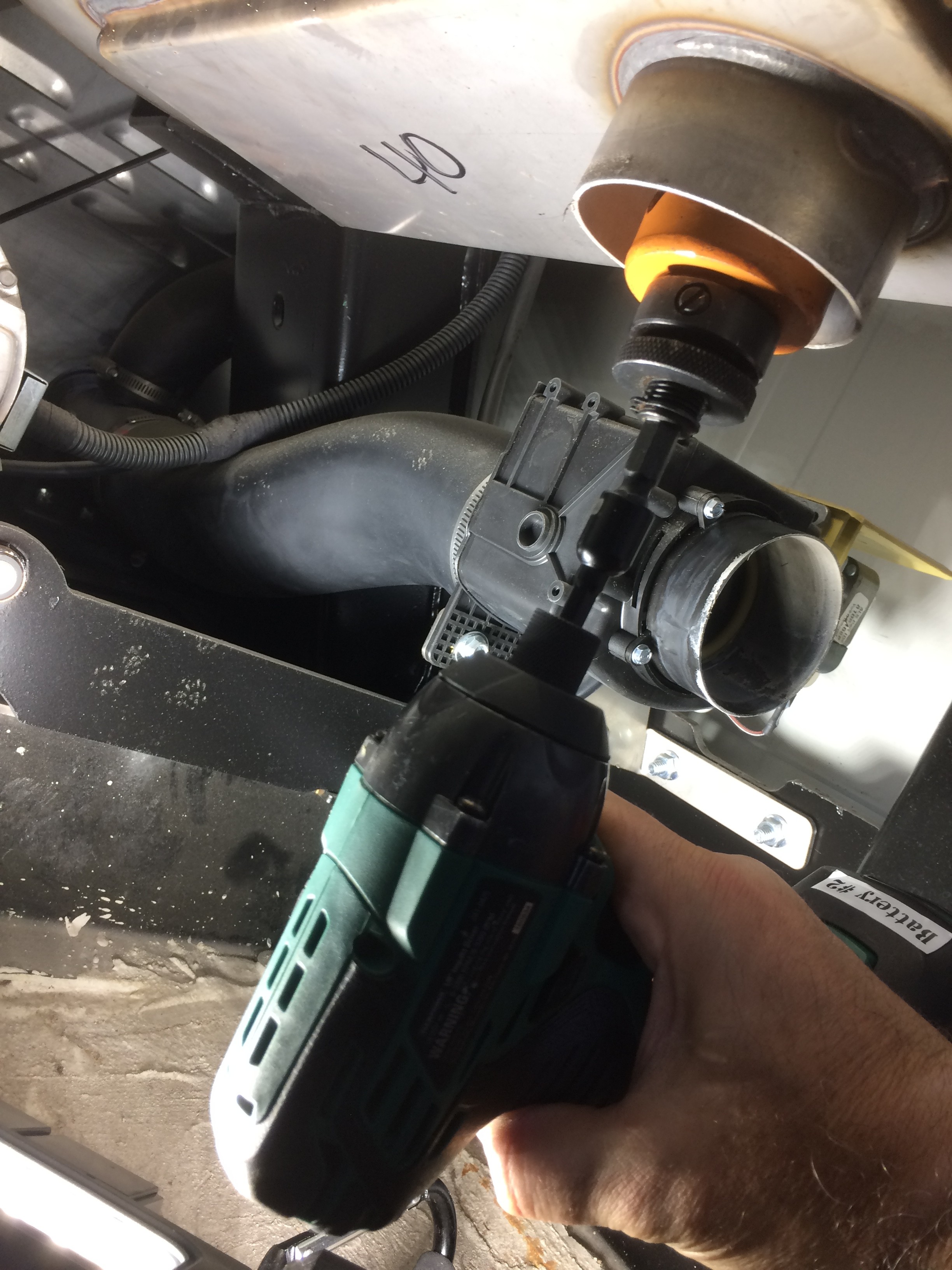 Hole saw through drain into tumbler below fin