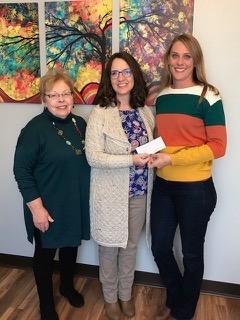 Susan Jones (Left) and Miranda Peterson (Right) presented Melissa Whitley (Center) with the chapter donation. 