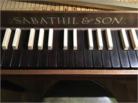 Keytops appear (IMO) to be rosewood naturals, ivory tops on maple sharps.