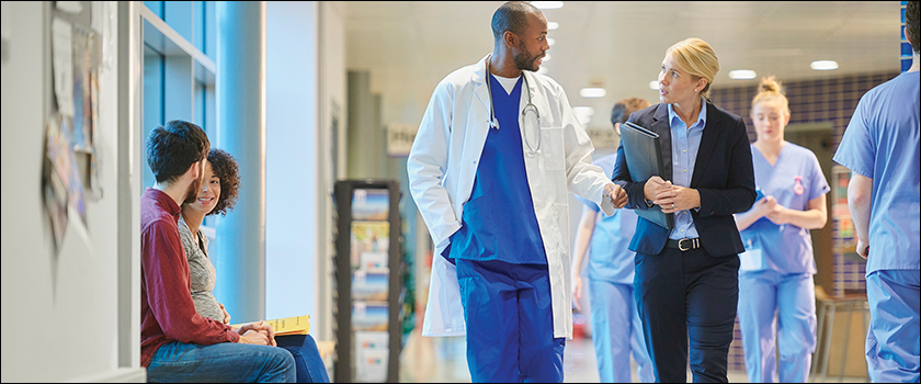 Medical professionals walking down a hallway