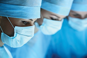 Breakthroughs pic three female medical professionals wearing surgical masks