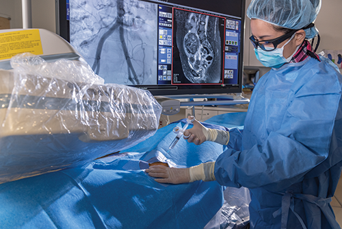 Breakthroughs hero Woman IR with patient performing procedure