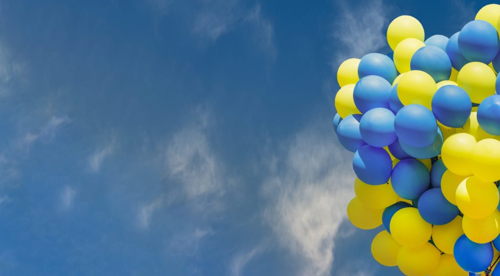 Yellow and blue balloons. Big bunch of balls. Balloon background with place for text.