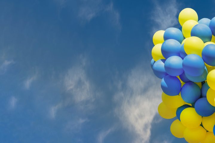 Yellow and blue balloons. Big bunch of balls. Balloon background with place for text.