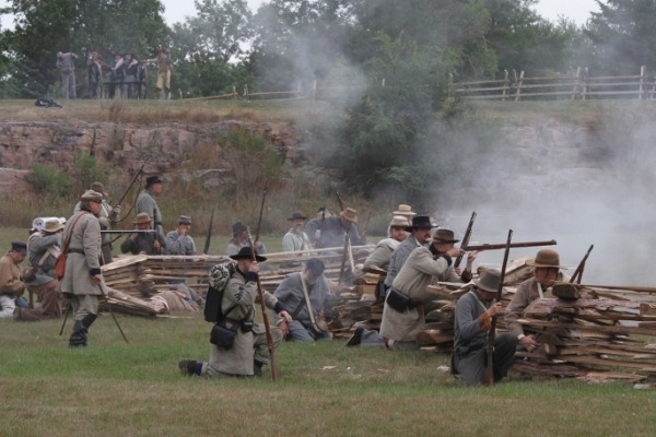 research the history of military reenactments