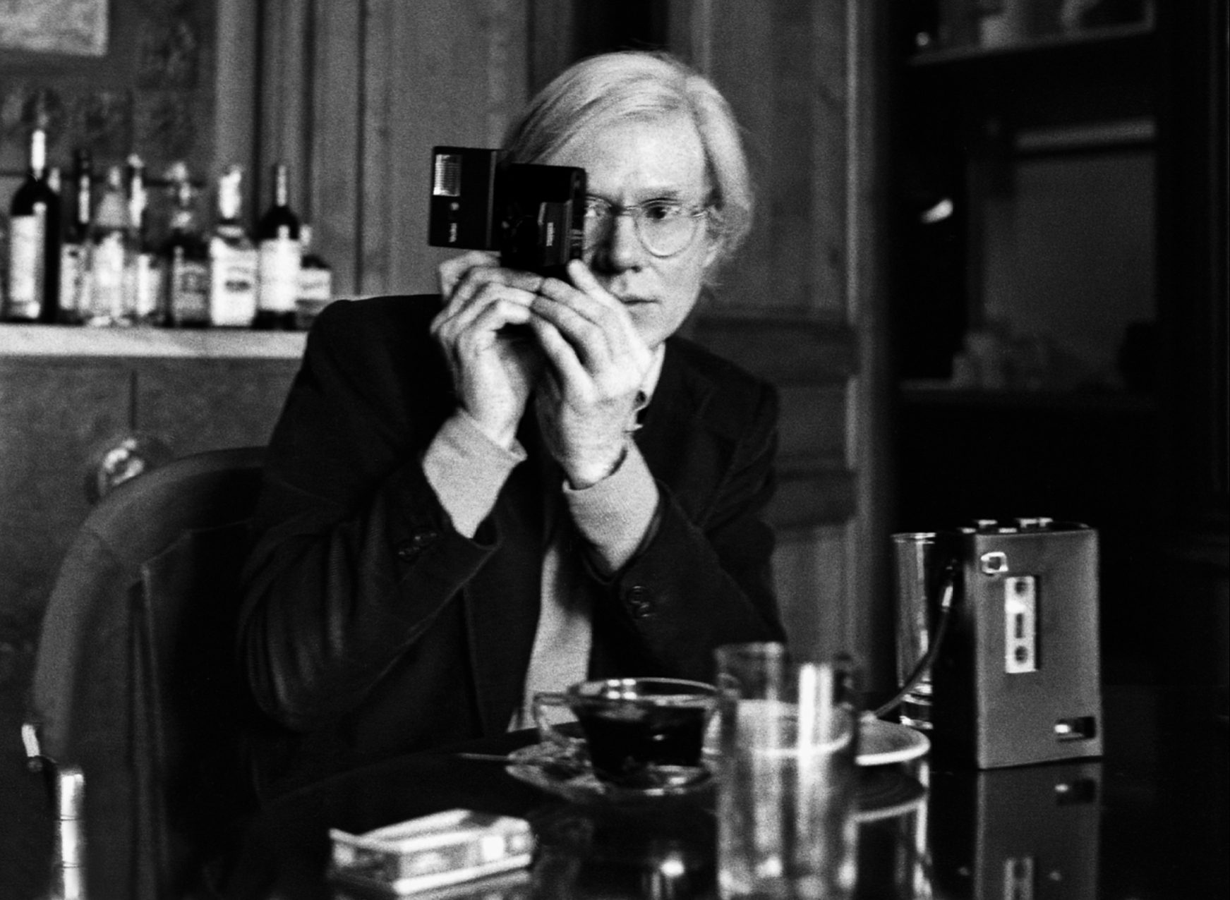 Andy Warhol with camera at The Factory, NYC
