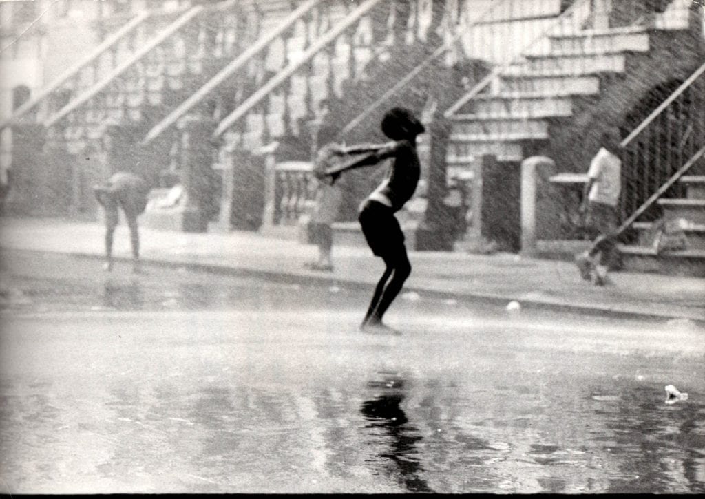 Chester Higgins Jr., Kid Cooling Off in Hydrant Spray, Harlem, Early silver gelatin photograph