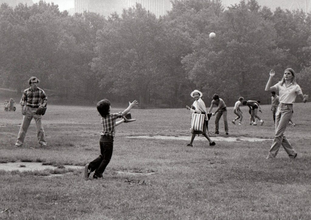 Brian Hamill, Woody Allen, child actor Damion Scheller, and actress Mariel Hemingway play softball in a scene from their film 'Manhattan,' New York