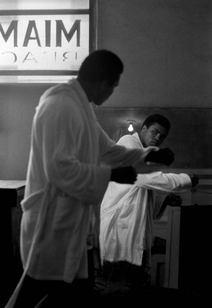 Brian Hamill, Muhammad Ali watches his reflection in a mirror during training at the 5th Street Gym, Miami, Florida photograph for sale