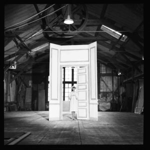 Georges Dambier, Karen Blanguernon and the fake door, 1960, Silver gelatin photograph