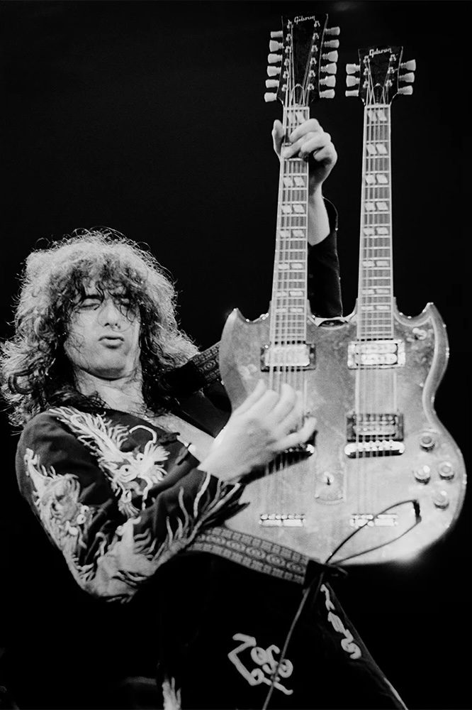 Terry O'Neill, Jimmy Page playing his double neck Gibson, 1975, Silver gelatin photograph