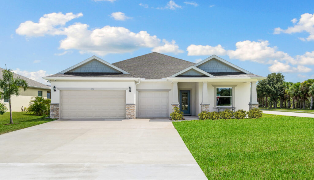 The exterior of the Sanibel floorplan from the Cornerstone collection by Holiday Builders.