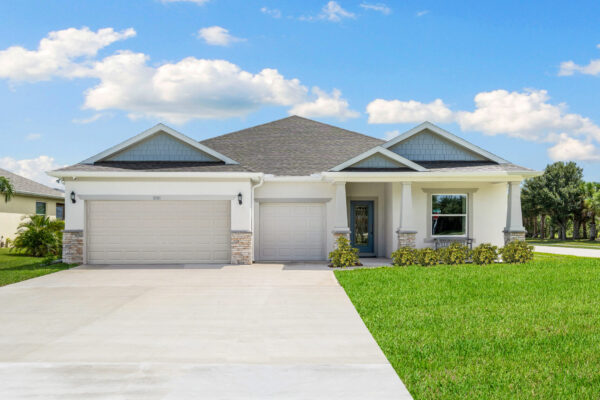The exterior of the Sanibel floorplan from the Cornerstone collection by Holiday Builders.