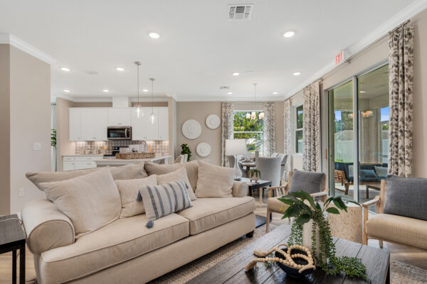 The Biscayne floorplan living and dining area from the Cornerstone collection by Holiday Builders.