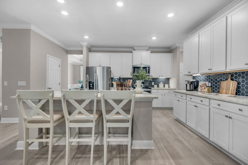 The kitchen in a new model home in Navarre florida by Holiday Builders.