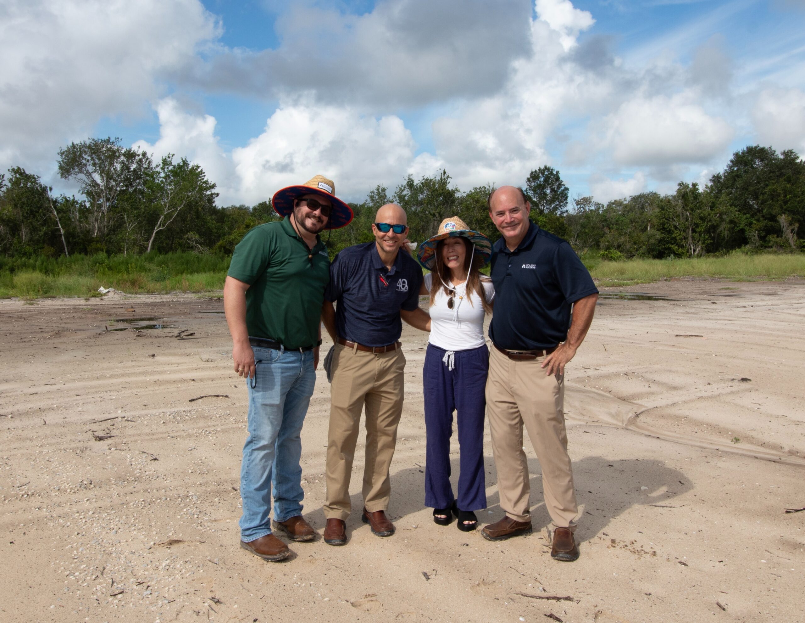 four people on a construction site