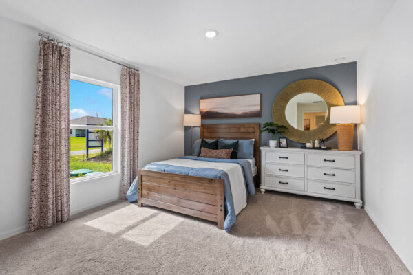 The guest bedroom of the Majestic floorplan from the Holiday Builders Value Collection