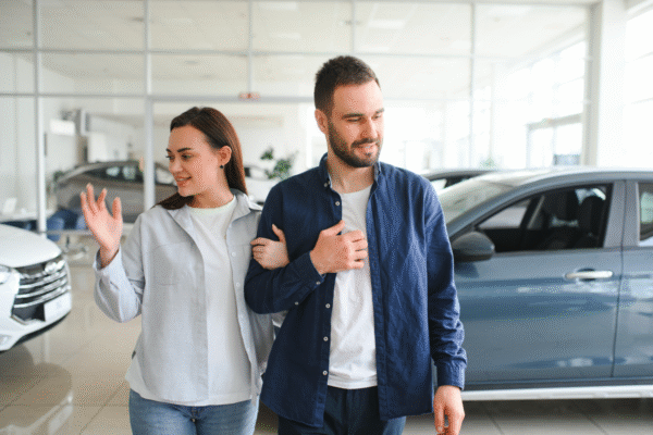 couple in a car dealership