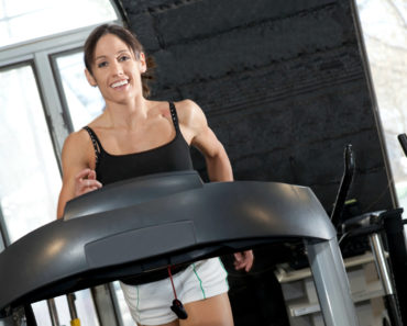 Woman running on a treadmill costing less than $1,000-Featured Image
