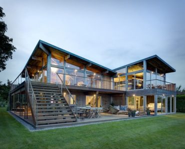 Dusk Panoramic View of 2-story Glass Home