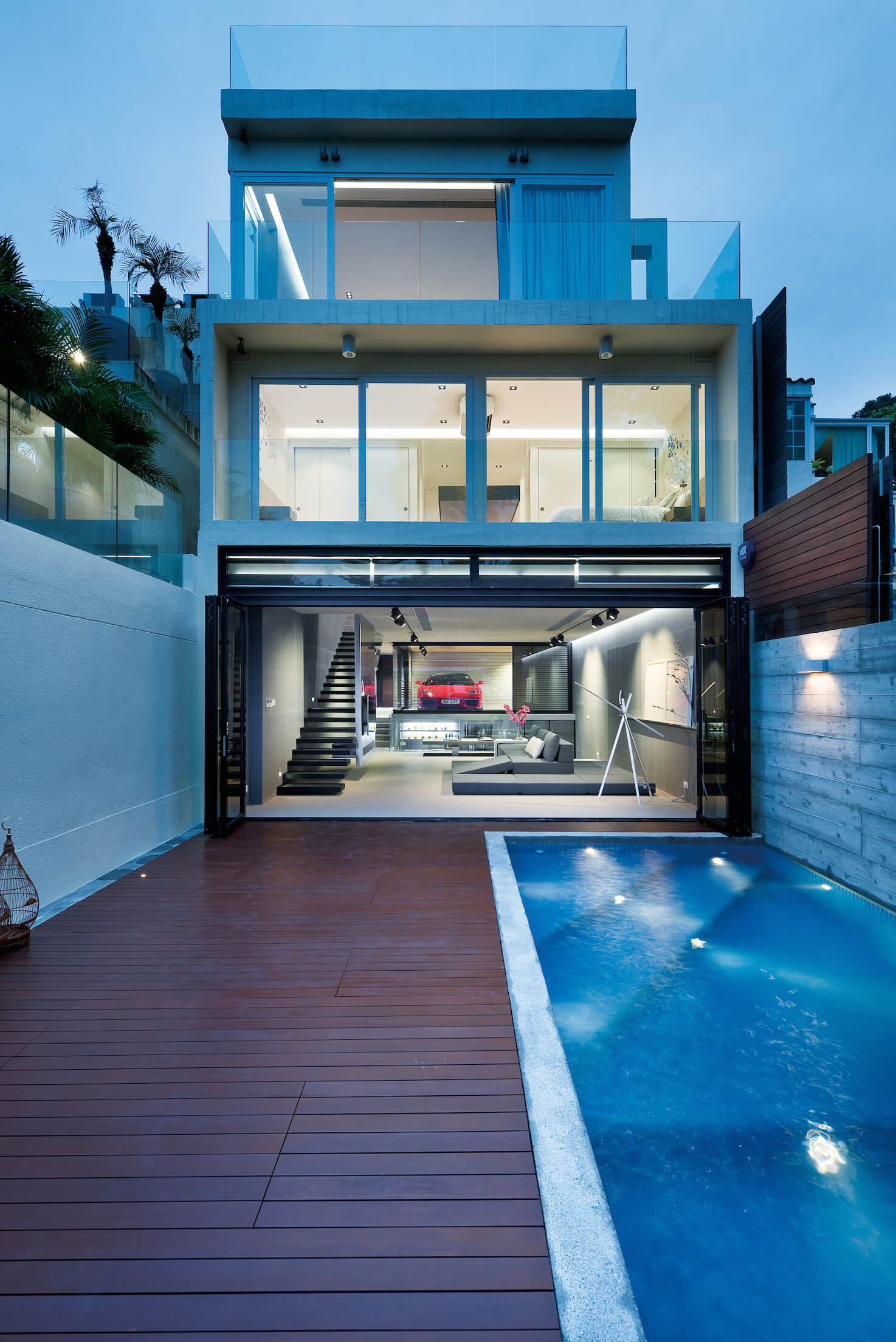 View from back patio: each floor is seen through transparent exterior, a series of immaculate modern boxes wrapped in glass. View from back patio: each floor is seen through transparent exterior, a series of immaculate modern boxes wrapped in glass.