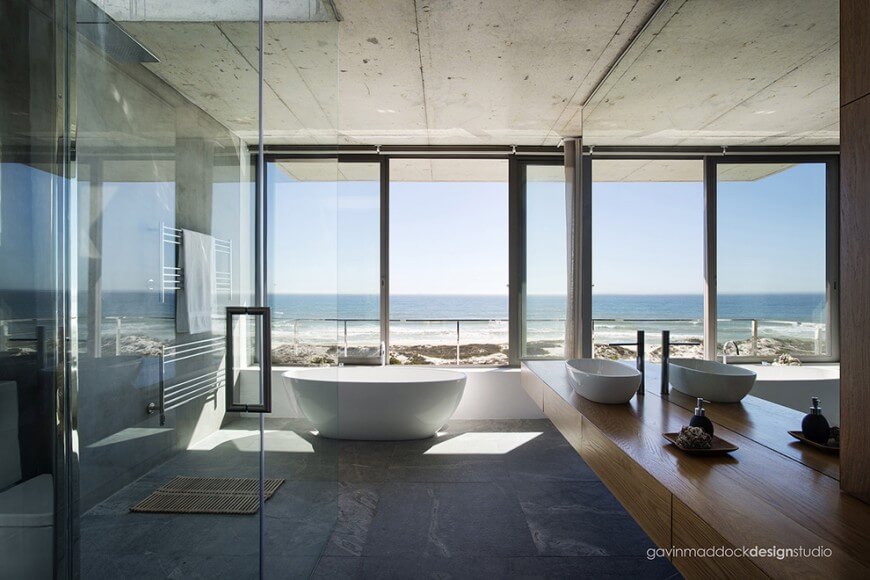 panoramic views through floor to ceiling sliding glass panels brighten this modern minimalist bathroom round - Custom Master Bathrooms panoramic views through floor to ceiling sliding glass panels brighten this modern minimalist bathroom round - Custom Master Bathrooms