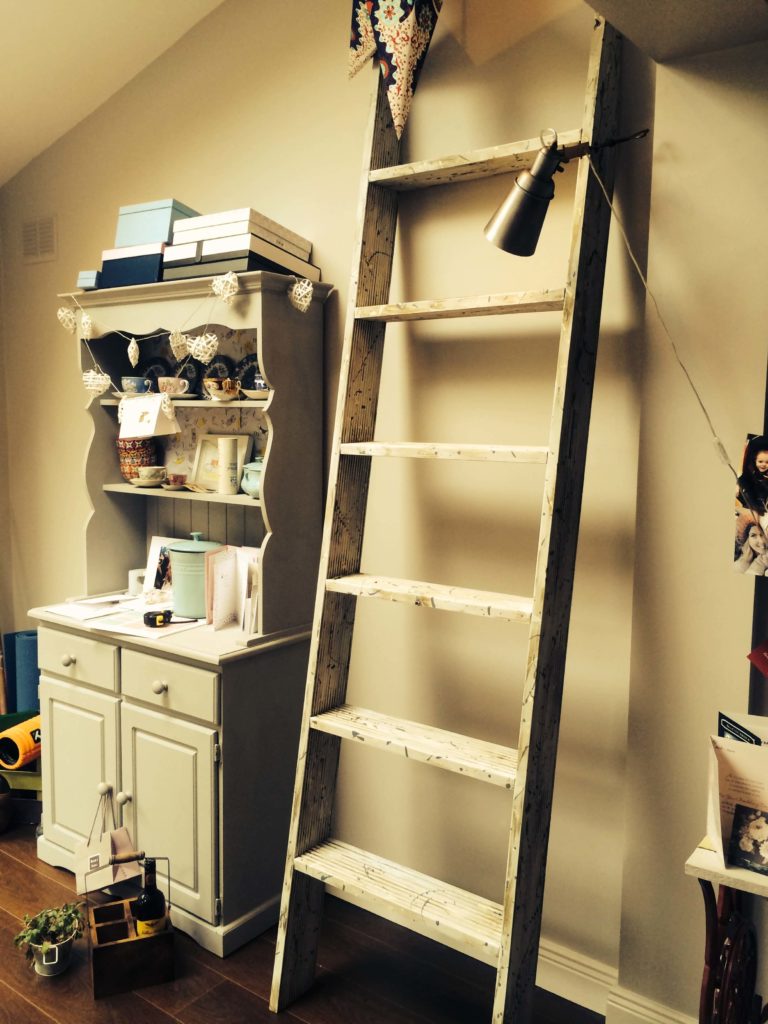 A side view of the shelving without any thing on the shelves. It perfectly fits into a small nook next to the vintage cabinet. A side view of the shelving without any thing on the shelves. It perfectly fits into a small nook next to the vintage cabinet.