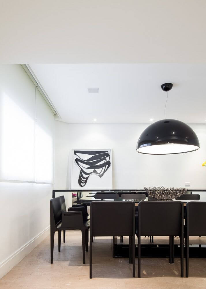 The formal dining room has light beige tile floors and crisp white walls. The modern dark wood dining set has two chairs at the heads of the tables, and is perfectly sized for a family gathering. The formal dining room has light beige tile floors and crisp white walls. The modern dark wood dining set has two chairs at the heads of the tables, and is perfectly sized for a family gathering.