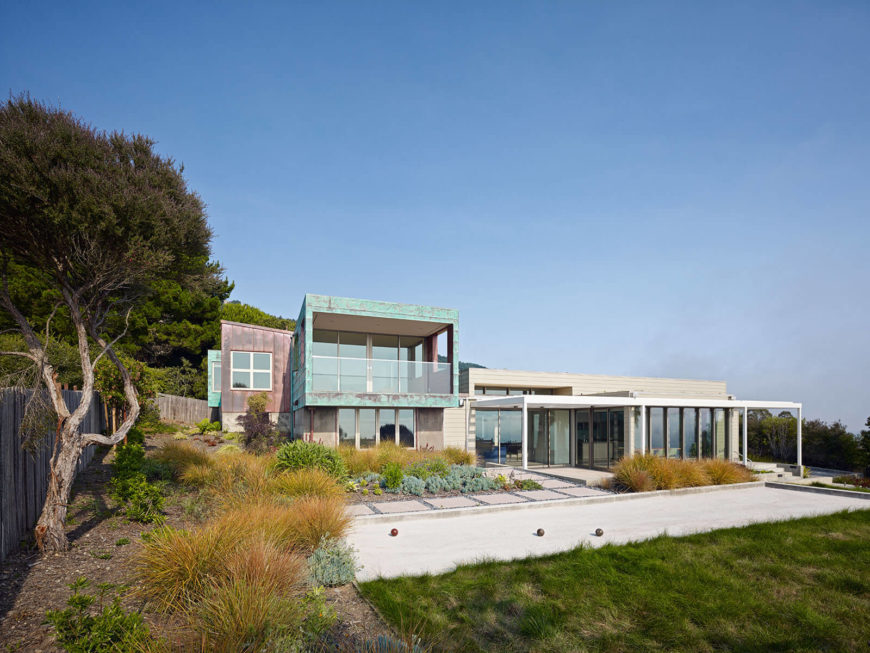 The segmented residence proudly displays zinc and copper panels, helping define various functions within the home. Full height glazing around much of the exterior amplifies the expansive ocean views. The segmented residence proudly displays zinc and copper panels, helping define various functions within the home. Full height glazing around much of the exterior amplifies the expansive ocean views.