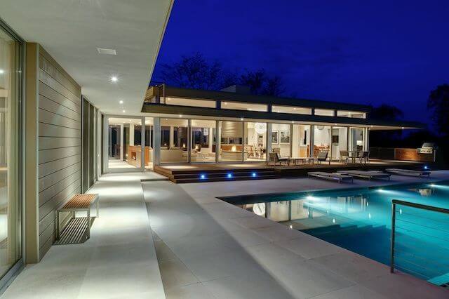 Another look ath the pool area, highlighting the amount of exterior lighting that keeps the home light, bright, and alive during the nighttime hours. Another look ath the pool area, highlighting the amount of exterior lighting that keeps the home light, bright, and alive during the nighttime hours.