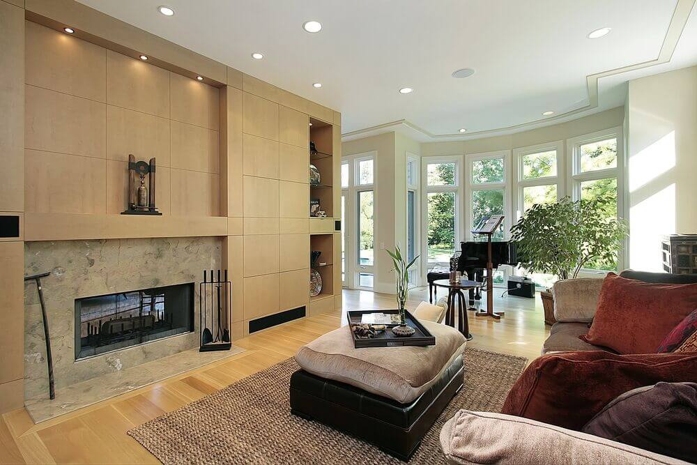 The wall around a fireplace is an excellent spot to add an accent wall, particularly when the majority of the room's walls are a light neutral. In this case, cubbies and shelving are built into the tile accent wall to further distinguish it from the rest of the room.