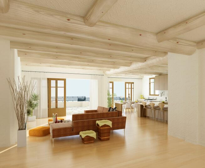 Light wood beams add subtle detail to this natural beach house. The richer brown tones of the lightly patterned sectional sofa and matching baskets draw the eye to the center of the living room, which has a pocket door leading outside to a terrace and stairs to the beach. Light wood beams add subtle detail to this natural beach house. The richer brown tones of the lightly patterned sectional sofa and matching baskets draw the eye to the center of the living room, which has a pocket door leading outside to a terrace and stairs to the beach.