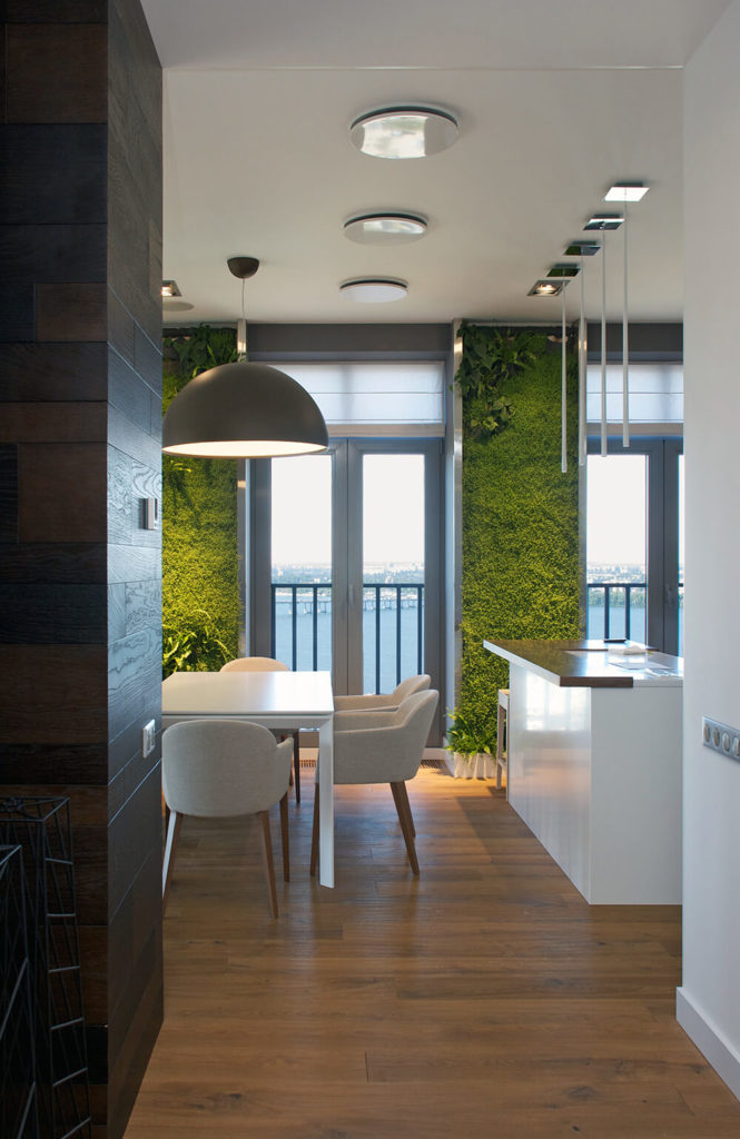 As we approach the entrance to the dining room, we see that the left wall transitions back to a rich wooden panel. This is also our first glimpse of the green walls that give this home its moniker. As we approach the entrance to the dining room, we see that the left wall transitions back to a rich wooden panel. This is also our first glimpse of the green walls that give this home its moniker.