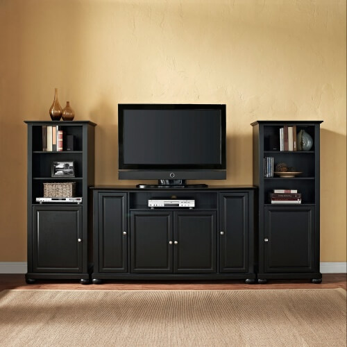 We love the simple yet elegant lines of this rich, dark stained wood entertainment center. The TV stand itself features a low, squat appearance for the ultimate in stability, while the flanking media towers offer additional shelving, display space, and enclosed cabinetry for all of your man cave needs. This one could work a nice contrast in a bright room or mix perfectly in a darker space. We love the simple yet elegant lines of this rich, dark stained wood entertainment center. The TV stand itself features a low, squat appearance for the ultimate in stability, while the flanking media towers offer additional shelving, display space, and enclosed cabinetry for all of your man cave needs. This one could work a nice contrast in a bright room or mix perfectly in a darker space.