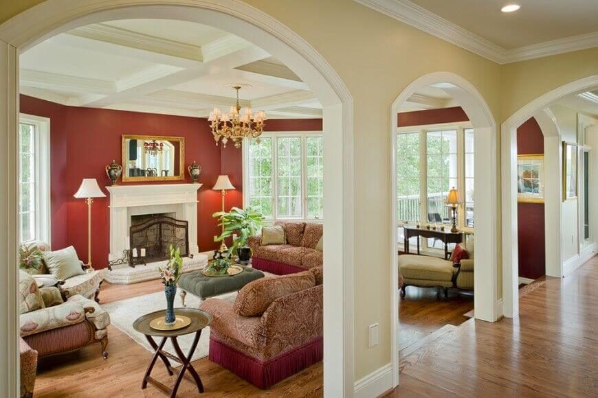 A Living Space With Large Hallway Openings Separated By Small Sections Of Wall The