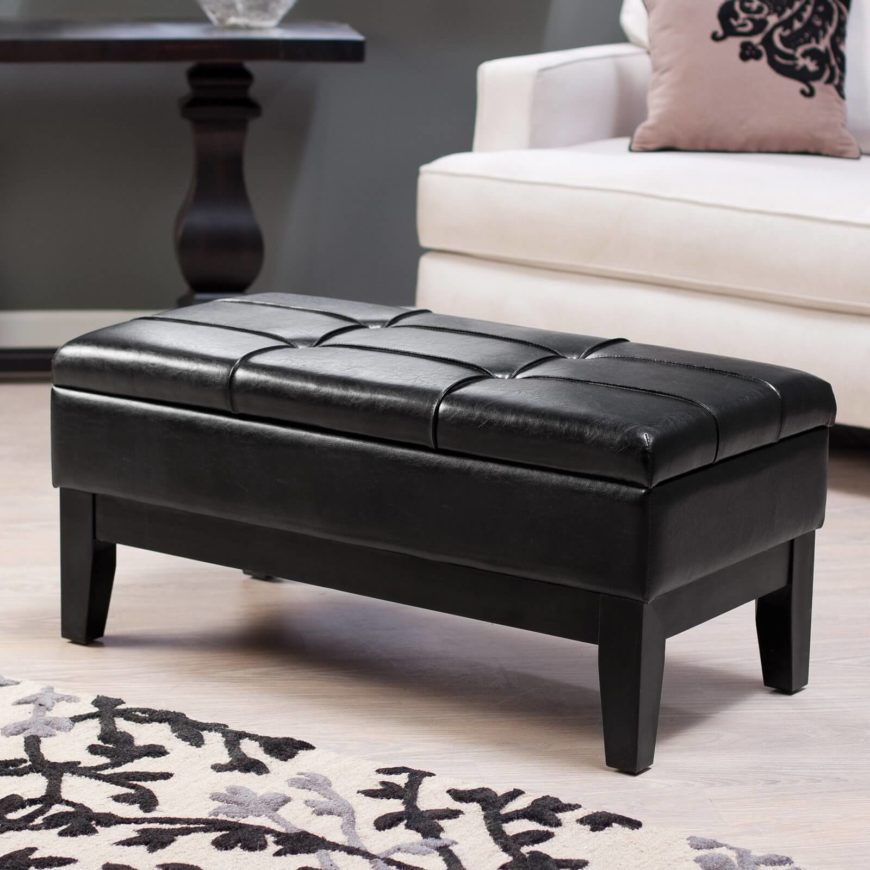 More than just an ottoman, the Livington storage bench is an extra seating solution with a cozy cushion on the top. The bench has a hidden compartment for storage, and is crafted out of sturdy wood, so it will last even though years of gatherings in your man cave. The faux leather is a cinch to clean, too! More than just an ottoman, the Livington storage bench is an extra seating solution with a cozy cushion on the top. The bench has a hidden compartment for storage, and is crafted out of sturdy wood, so it will last even though years of gatherings in your man cave. The faux leather is a cinch to clean, too!