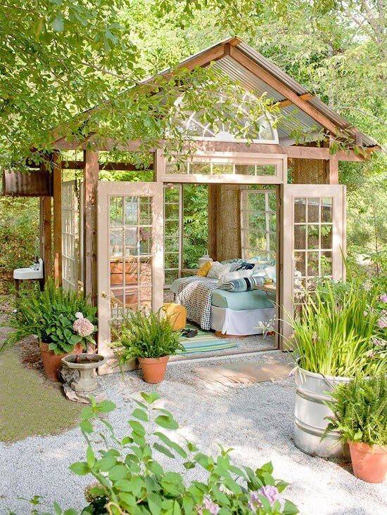 Bright and serene, french doors act as both walls and windows for this picturesque backyard escape. Bright and serene, french doors act as both walls and windows for this picturesque backyard escape.