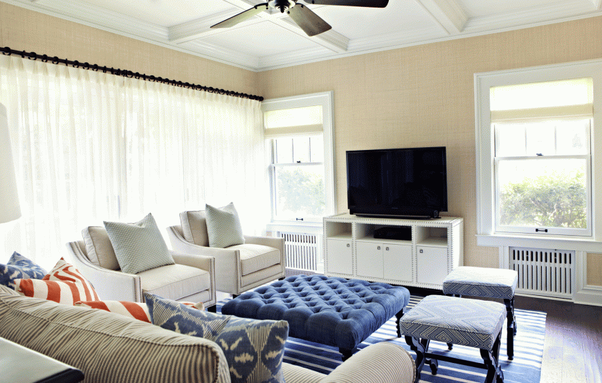 A coffered ceiling adds elegance to a family room, allowing it to double as a more formal living room. A coffered ceiling adds elegance to a family room, allowing it to double as a more formal living room.