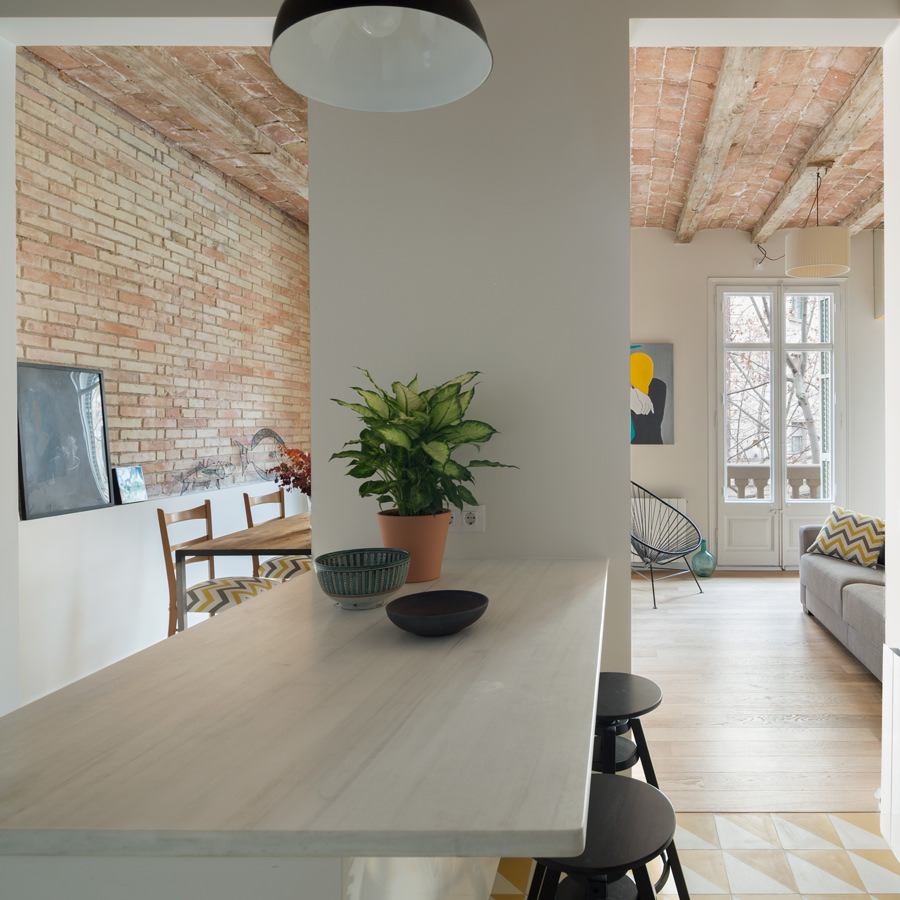 A functional kitchen working table hiding in between two passages from the dining area and living room. A functional kitchen working table hiding in between two passages from the dining area and living room.