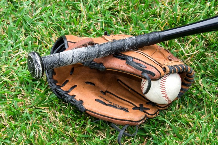Baseball equipment on grass