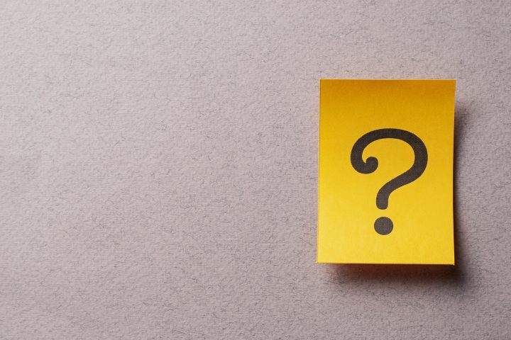 Colorful yellow card with printed question mark